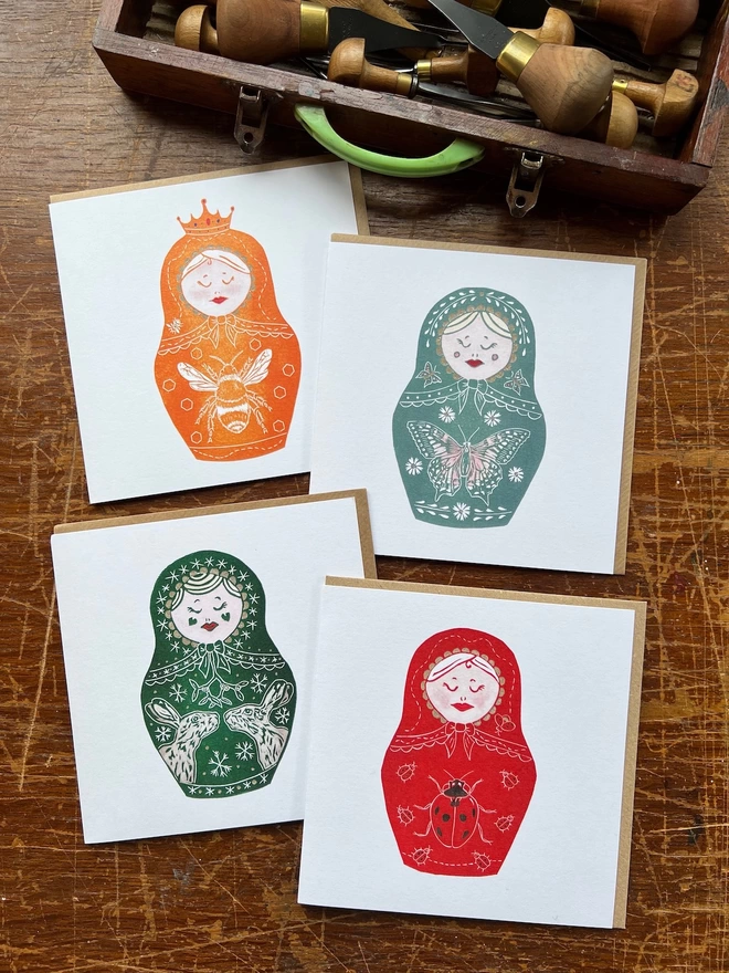 four matryoshka doll card designs 