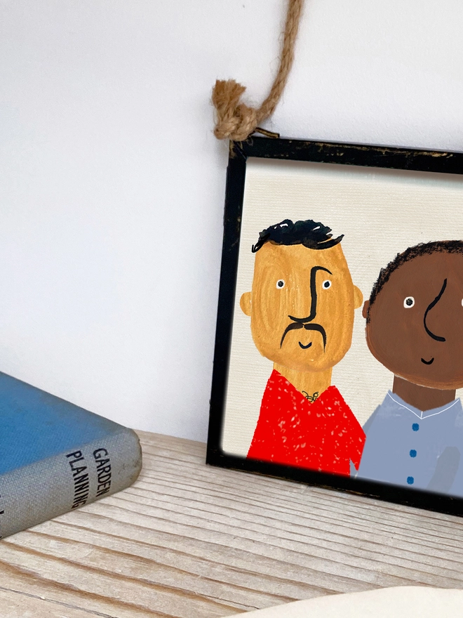 hand painted picture of man and man in a frame