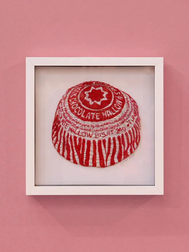 Tunnocks Teacake Embroidery Wall Art with a White Frame and Pink Background