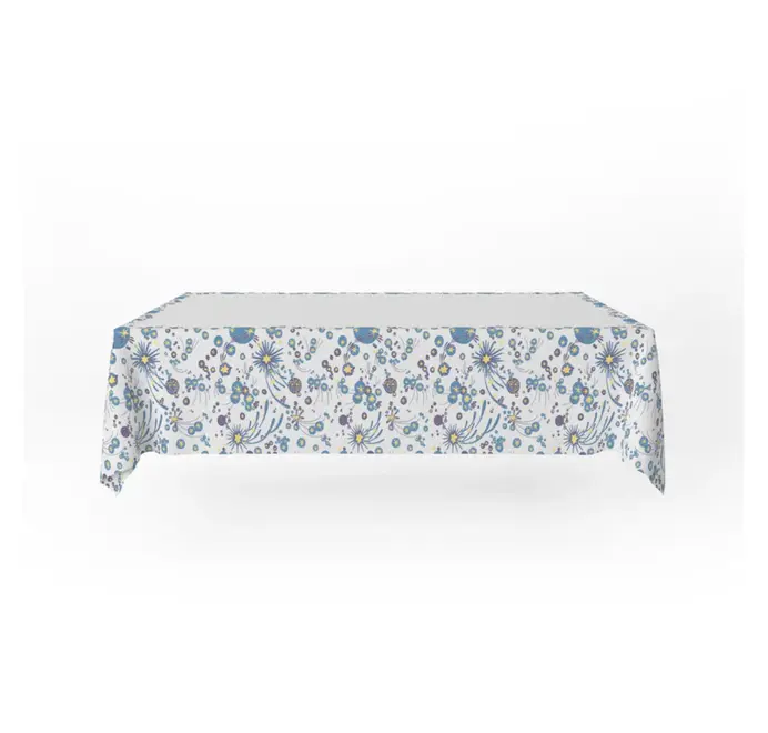 Solaris Tablecloth In White Or Blue. White tablecloth with blue and yellow starburst motifs.