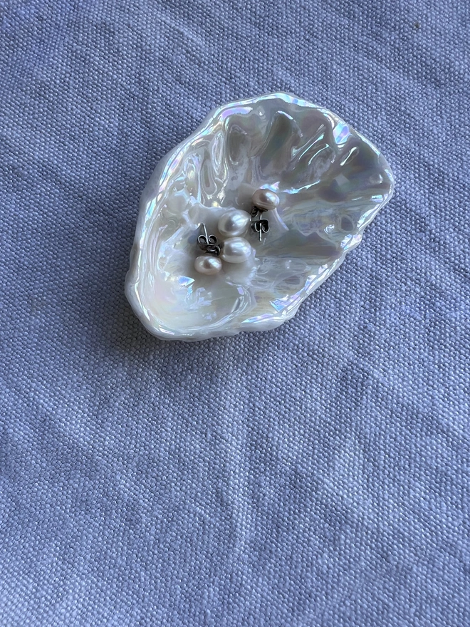 handmade porcelain oyster shell salt and pepper dish with pearl lustre
