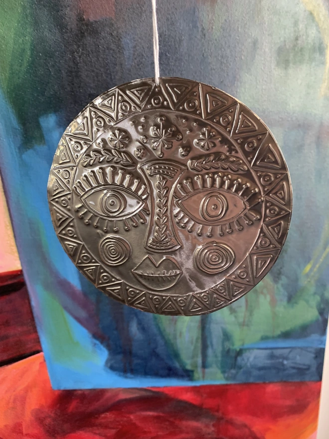 hand embossed tin sun decoration