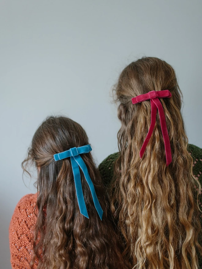 two girls in their velvet hair bows