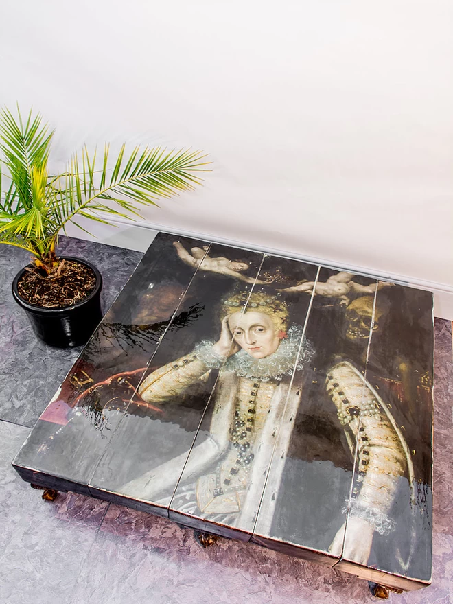 grand coffee table with image of a queen on top