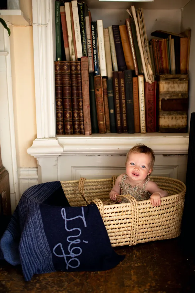 Example of baby blanket laid on mosses basket