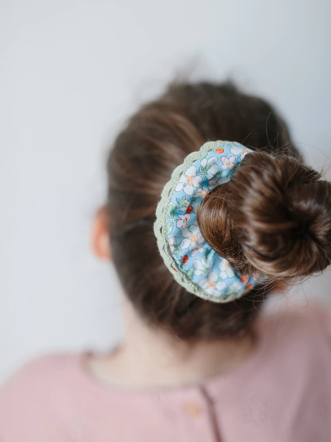 girl with liberty hair scrunchie in her brown hair
