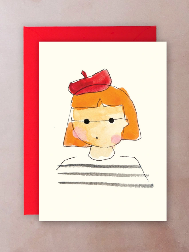 Hit Girl mini card - a girl with orange hair wearing a red beret, striped top and small black sunglasses