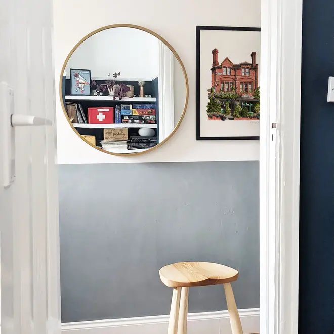 Nunhead Skehans Giclée Print (Unframed), a print of a brick pub in a black frame against a plain backdrop in a living room. 