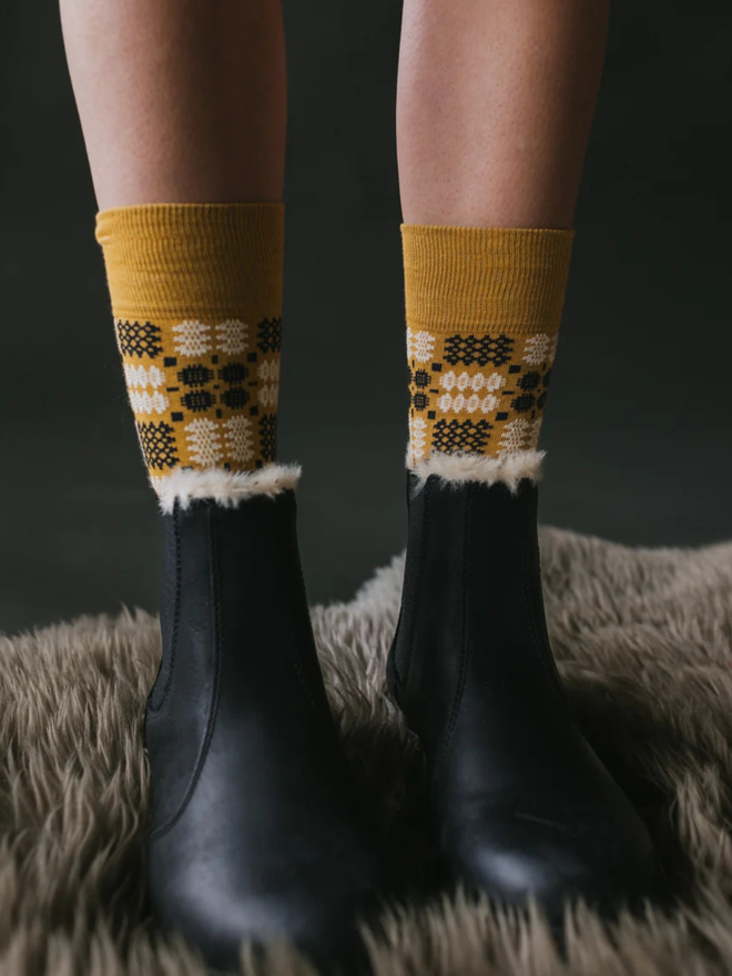 yellow brown knitted socks with boots