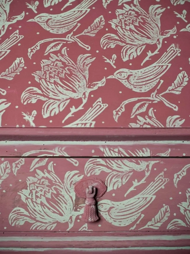 Flock Patterned Paint Roller, painting wall with pink and white pattern. 