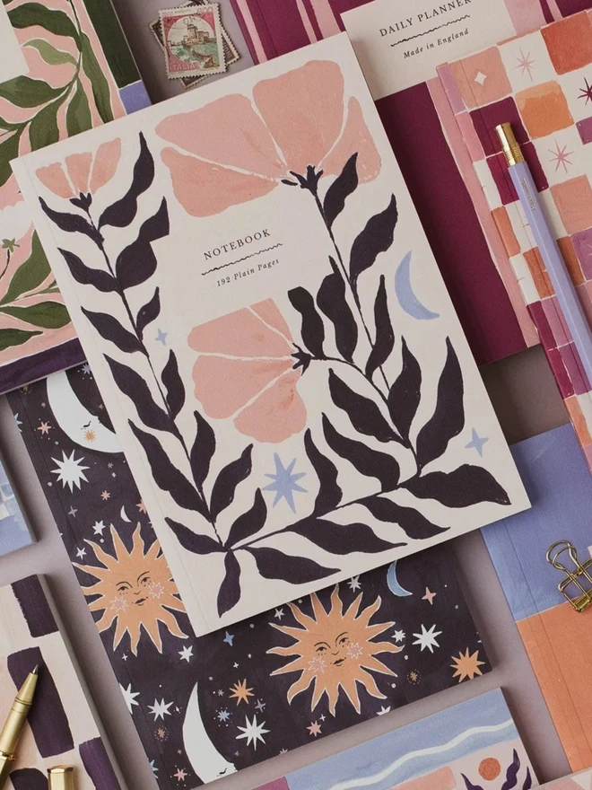 Botanical Notebook on top of other Sister Paper Co notebooks