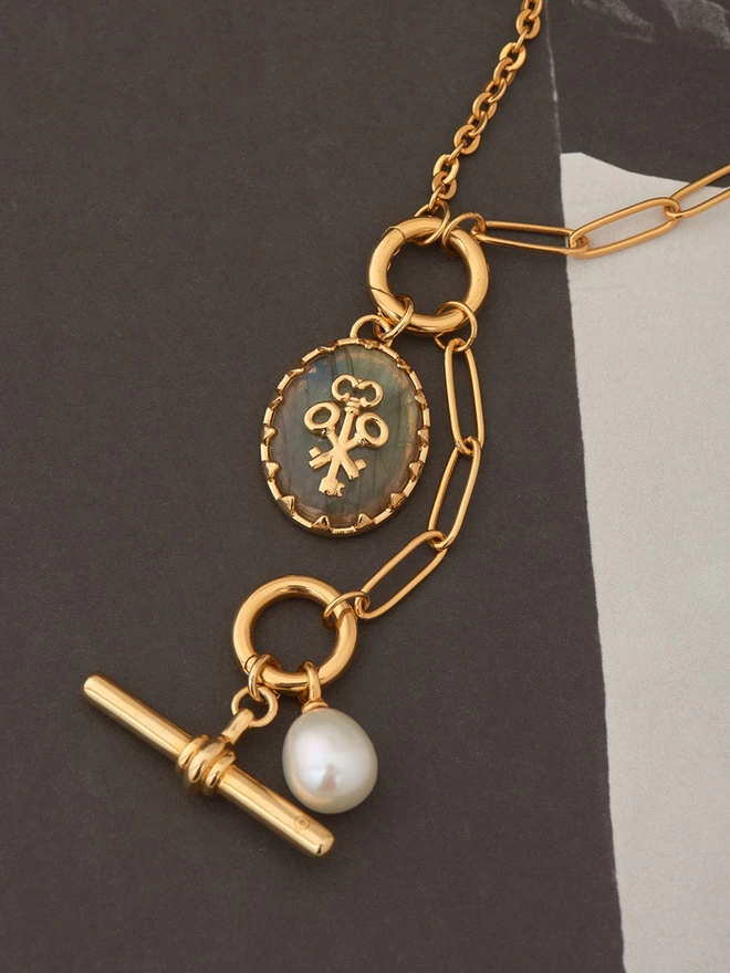 gold necklace with charms and pendants