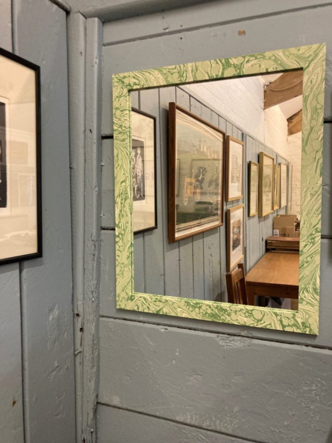 Large Mirror. A large mirror against a wall.