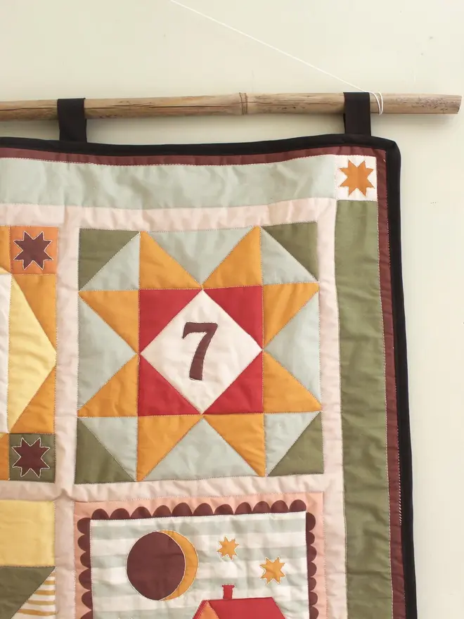 personalised baby quilted wall hanging. a patchwork hanging quilt decoration to commemorate a baby's birth.