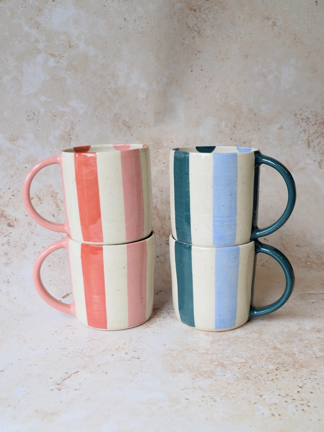 Bonbon Mugs — stacked red and pink, and blue and cream striped designs