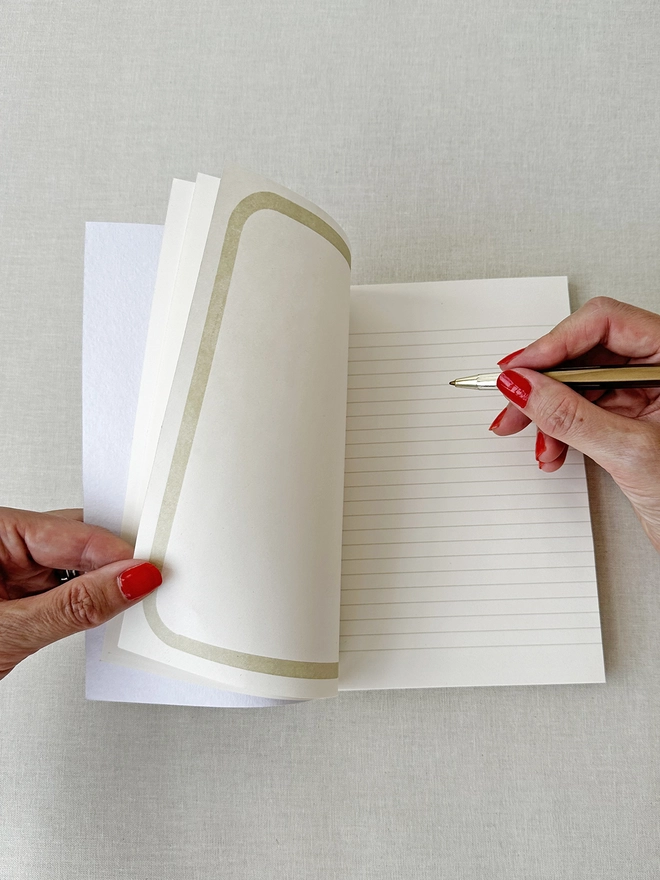 Writing in the open pages of journal