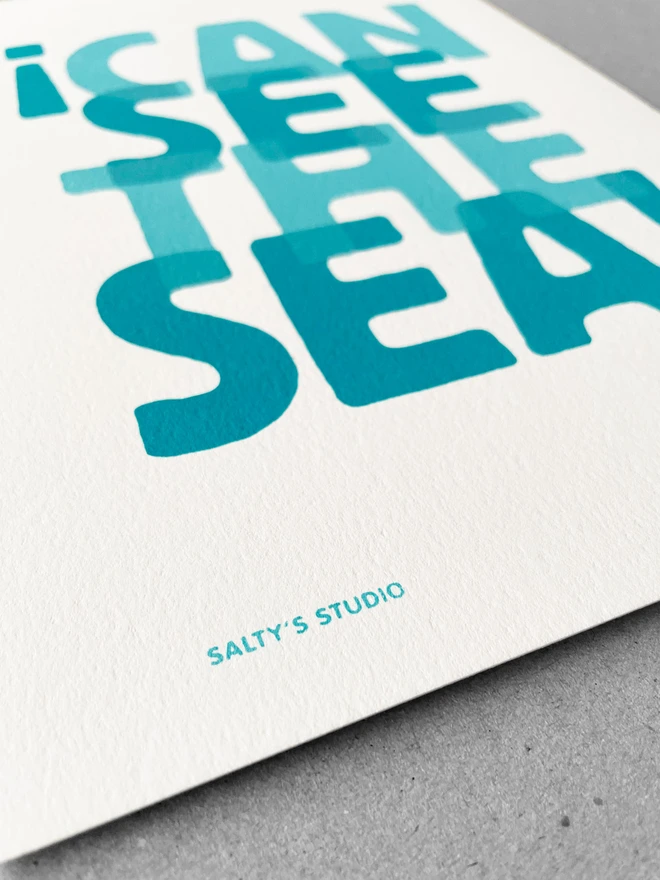 Close up of I Can See the Sea A4 print, the Salty’s Studio name printed in the lower left corner 