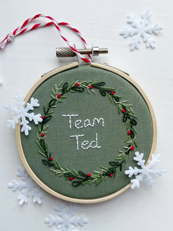 Hand embroidered Christmas decoration with the personalisation Team Ted