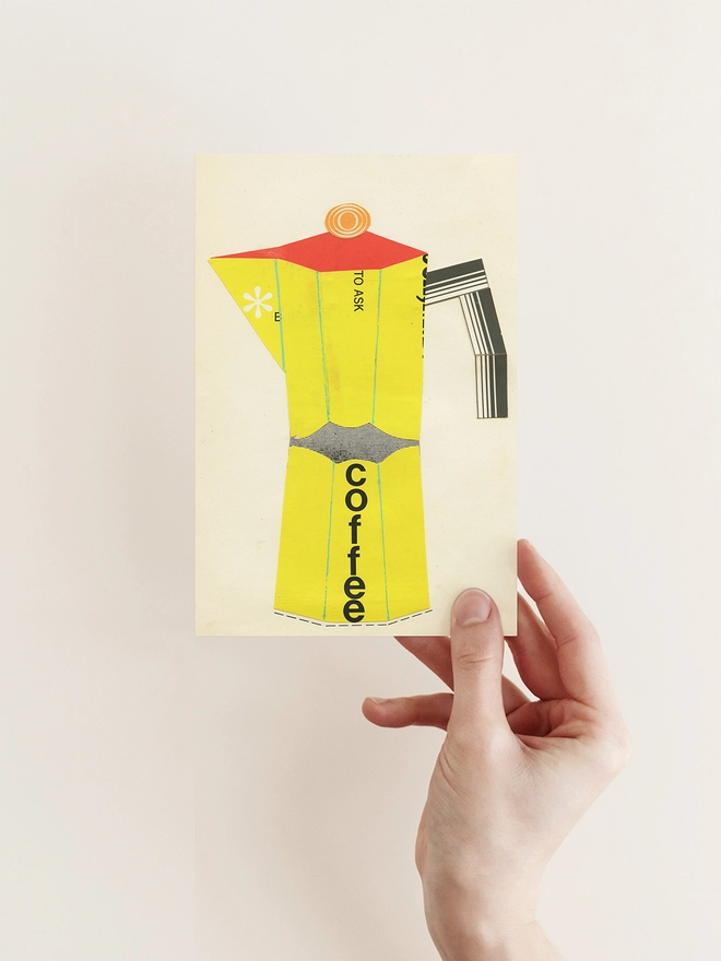 A greetings card and brown kraft envelope depicting a bright red and yellow coffee pot.