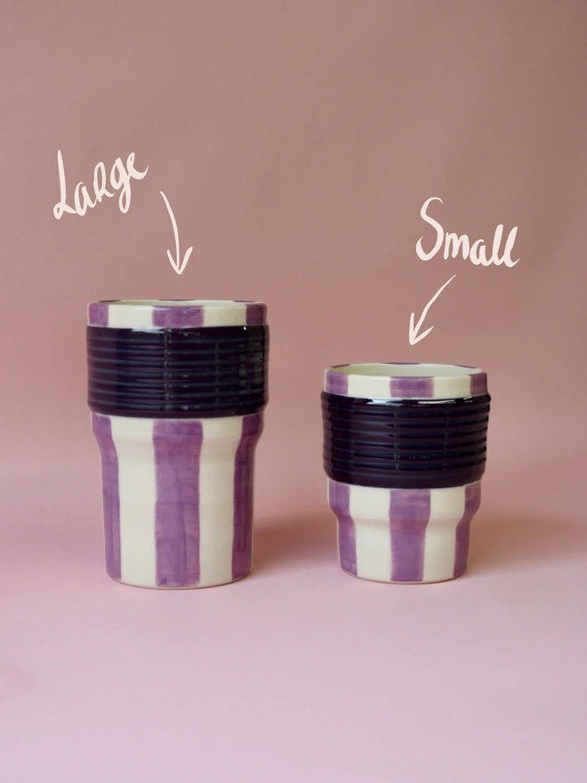     Large and small purple striped ceramic tumblers