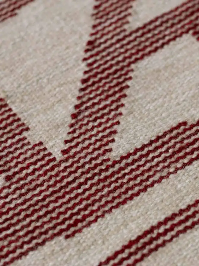 Tudor Flatweave Rug, a colourful rug in a living room.