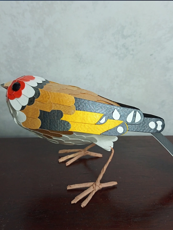 handmade sculpture of a Eurasian goldfinch