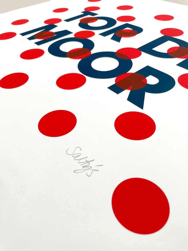 Bottom right corner of Tor de Moor screenprint in dark blue, with red polka dots on top. Showing the Salty’s pencil signature.