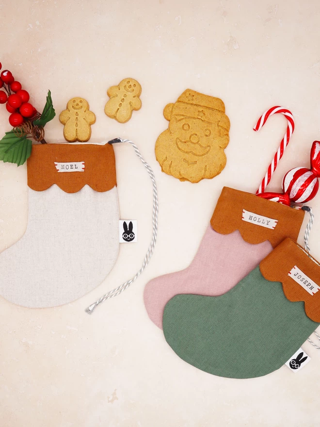 christmas stockings in natural linen, pink and green 