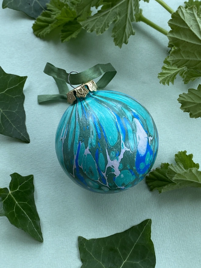 A large hand-marbled ceramic bauble