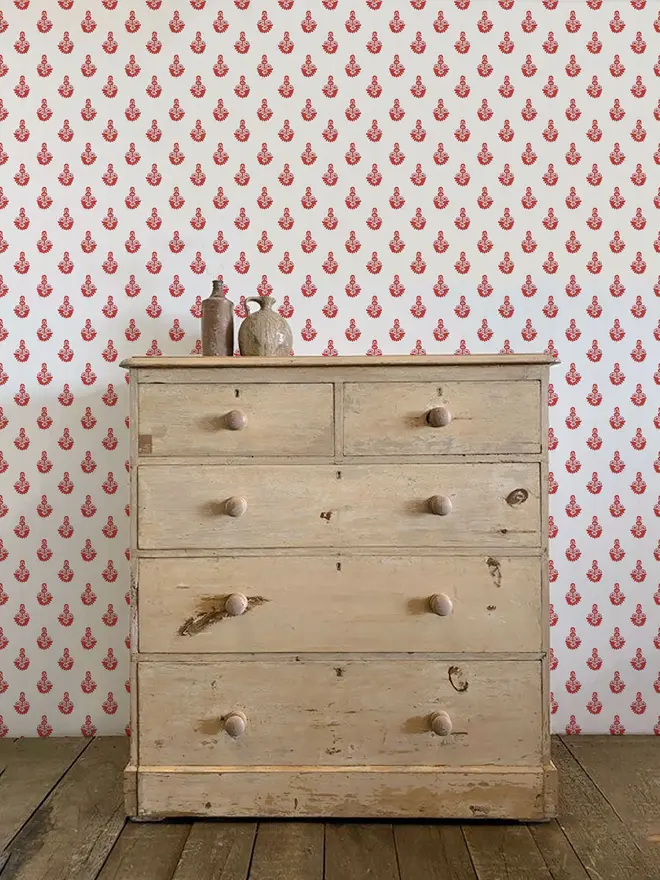 dana illustrated floral wallpaper. a white and red patterned wallpaper on a wall.