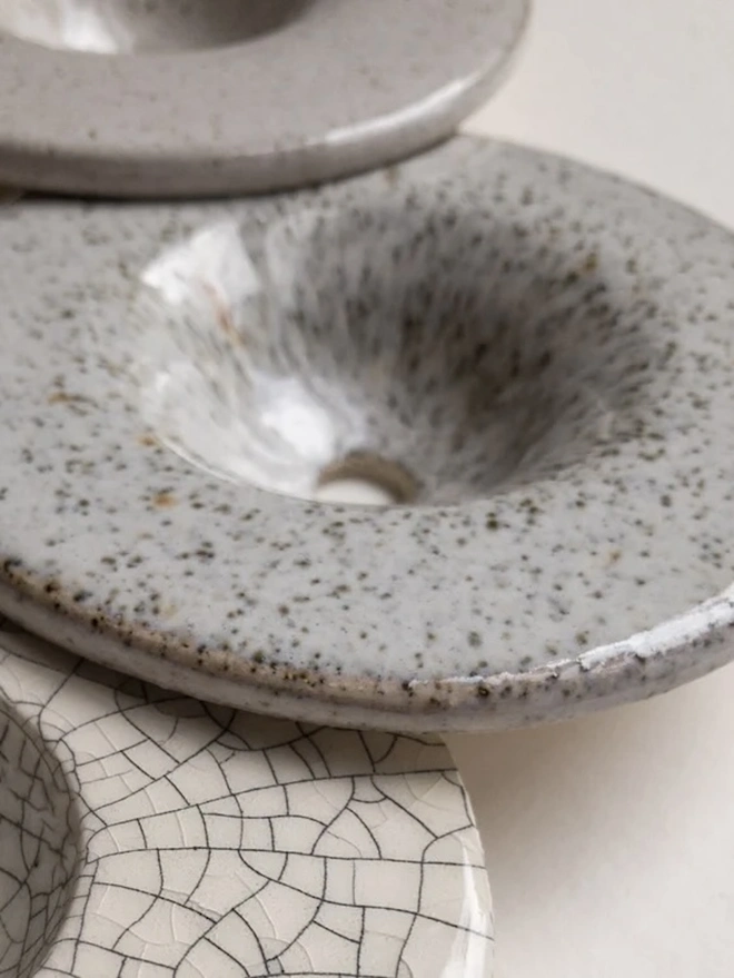 DIY Growing Kit in different finishes, the growing discs sitting on a plain surface. 