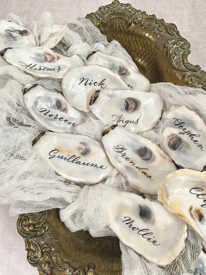 oyster shells with names written in ink