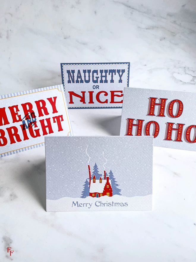 vintage typography and hand lettered christmas cards in blue and red