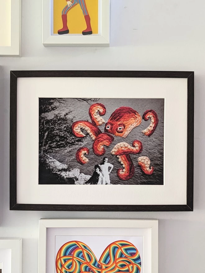 B & W photo of couple with embroidered octopus behind them, framed on wall