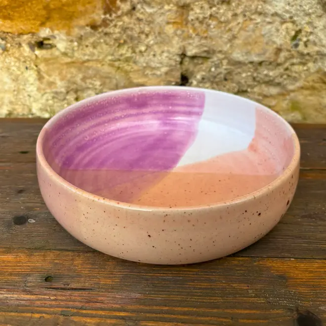 Ice Cream Sundae Pasta Bowl, a colourful pasta bowl sitting on a wooden surface against a brick backdrop. 