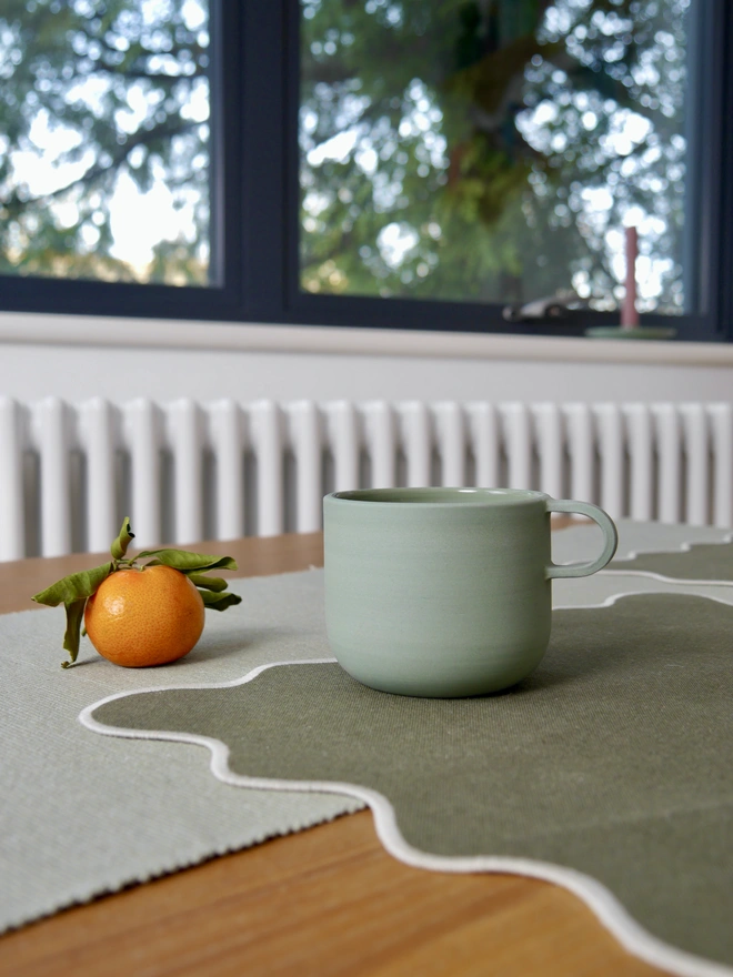 sage green curved ceramic mug