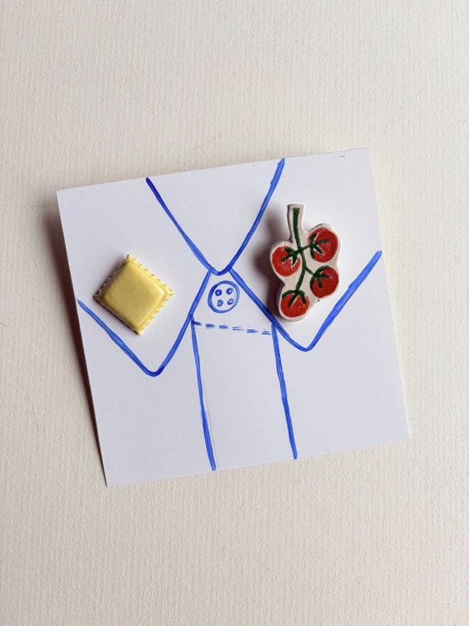 Foodie collar pins. A ravioli and vine tomato pins on a collar hand-sketched on paper