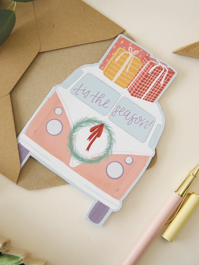 Illustrated festive camper van cutout Christmas card 