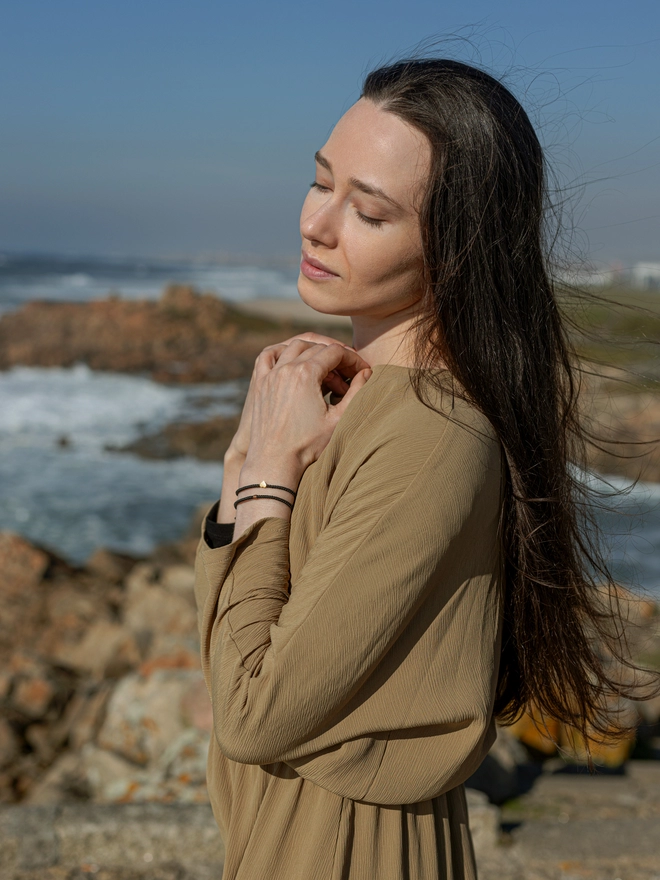 women wearing a heart bracelet