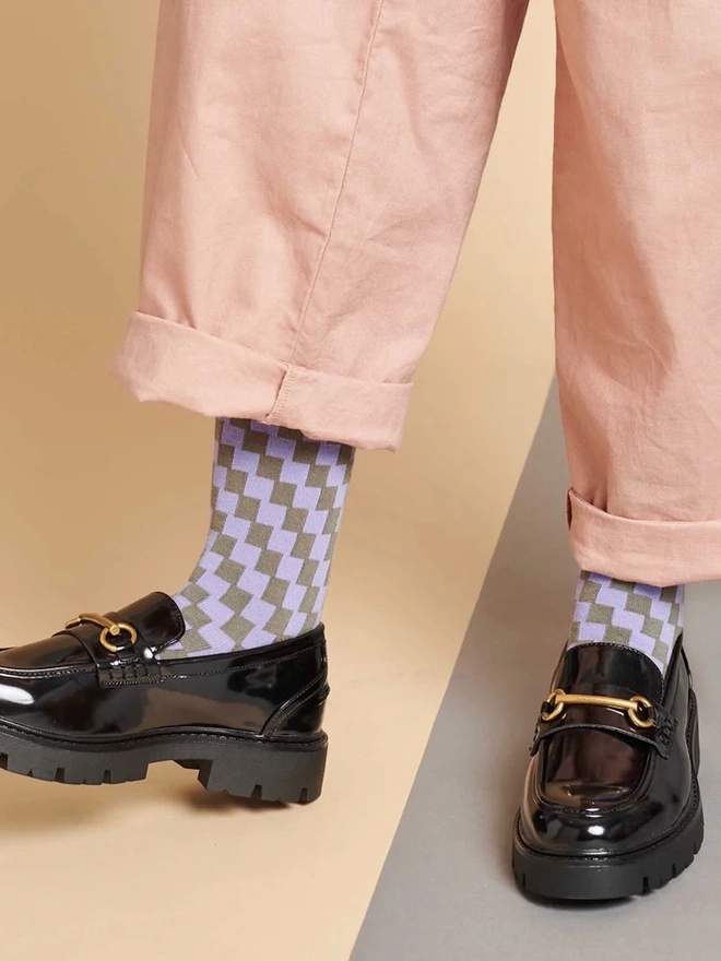 Women's Organic Cotton Ankle Socks Packs (Sets Of 3), a person wearing a pair of colourful patterned socks. 