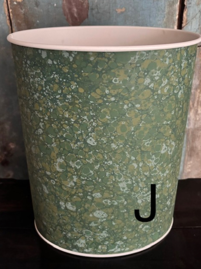 Oval Waste Paper Bin. A bin in J