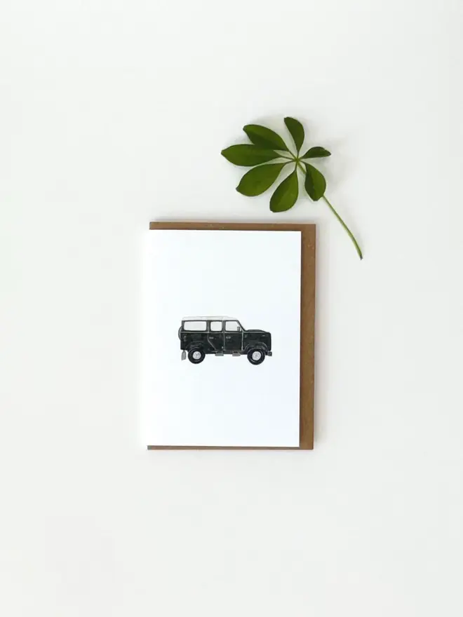 land rover defender illustrated mini card. card photographed against plain white background.
