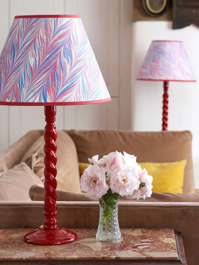 Barley Twist Lampbase with Shade. A red lamp with a pink shade.
