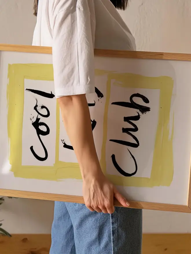 'cool kids club' art print. a print with a white and yellow background with a slogan in black lettering
