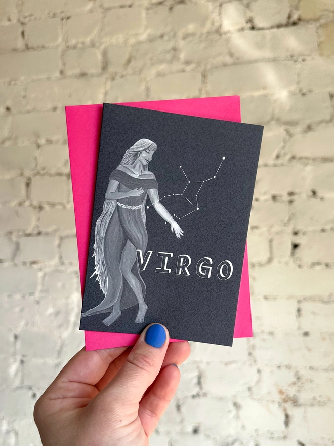  a greetings card featuring a greyscale illustration of a zodiac style maiden with the text “VIRGO” with a neon pink envelope