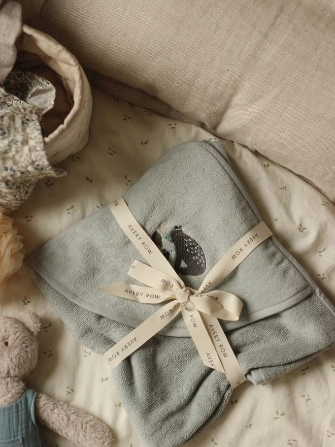 A hooded towel baby with bear embroidery