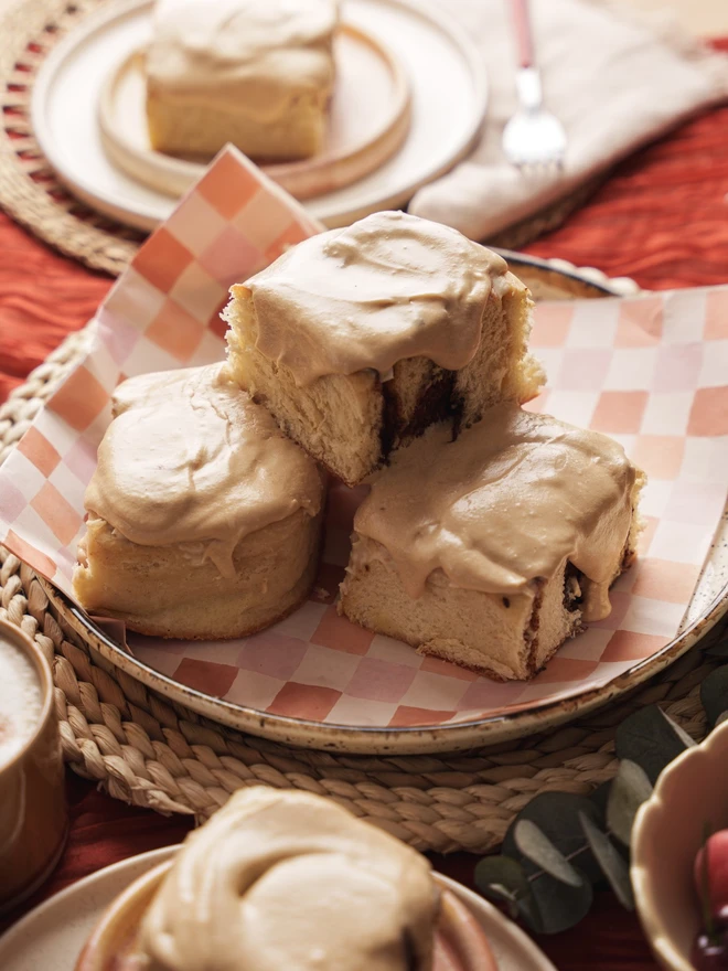 spiced latte buns with coffee icing in the center of a brunch table