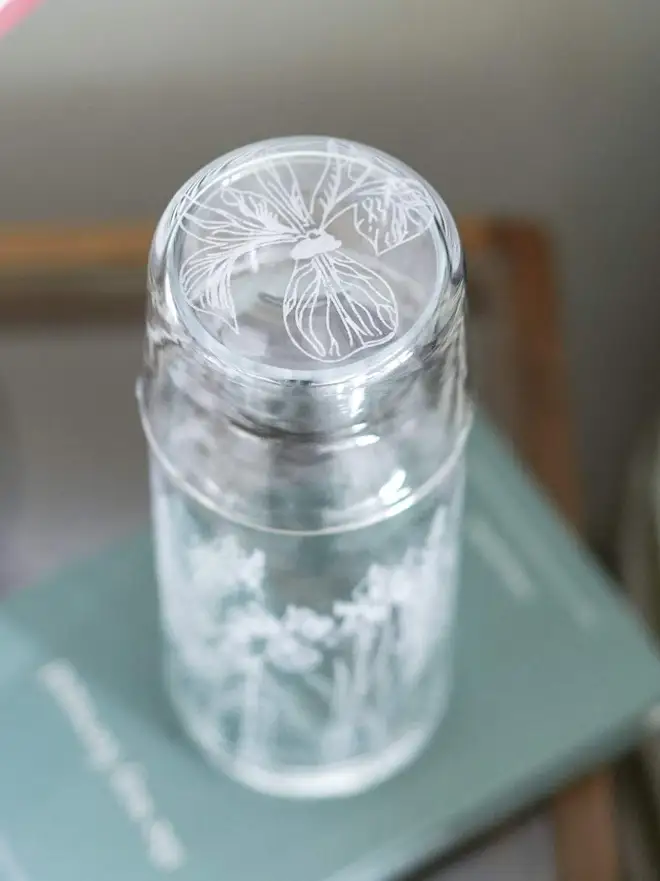 Floral Mini Carafe & Glass Set, on a clear table. 
