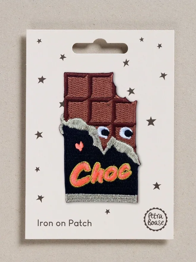 Chocolate iron on embroidered fabric patch.