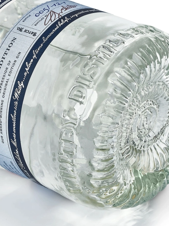 Navy Strength Gin, a bottle of gin sitting on a white plain surface